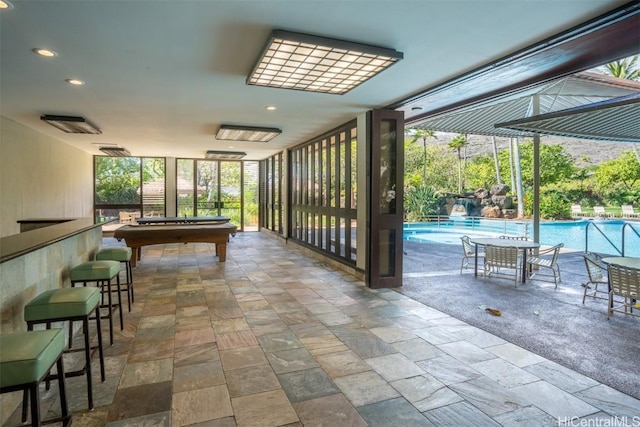 rec room with floor to ceiling windows and billiards