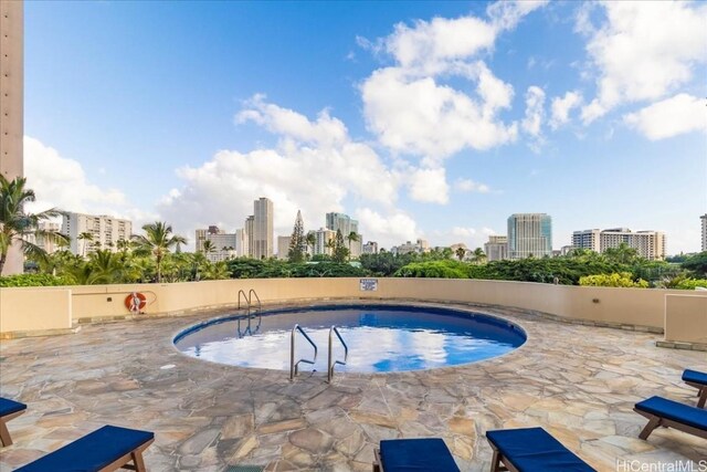 view of swimming pool featuring a patio area