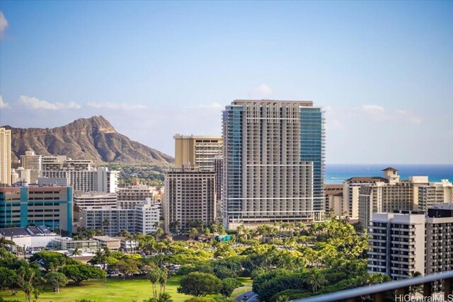 property's view of city featuring a water and mountain view