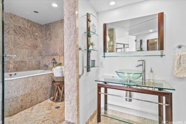 bathroom featuring shower with separate bathtub and vanity