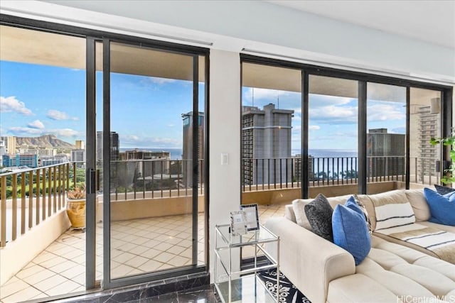 living room with a wealth of natural light and a water view