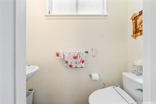 bathroom featuring toilet