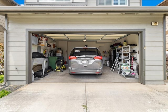 garage featuring stainless steel fridge