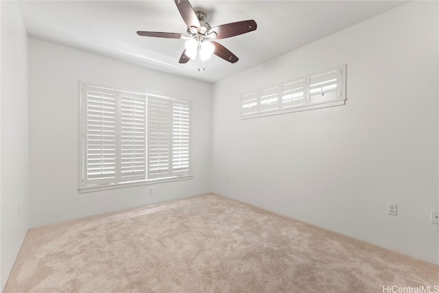 unfurnished room featuring carpet floors and a ceiling fan