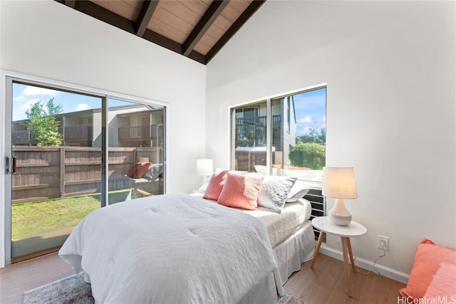 bedroom featuring wood ceiling, light hardwood / wood-style floors, high vaulted ceiling, and beamed ceiling