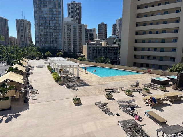 view of swimming pool featuring a patio area