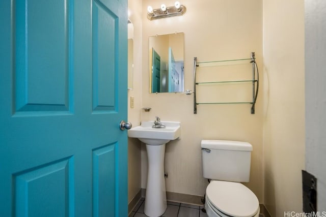 bathroom with tile patterned floors, sink, and toilet