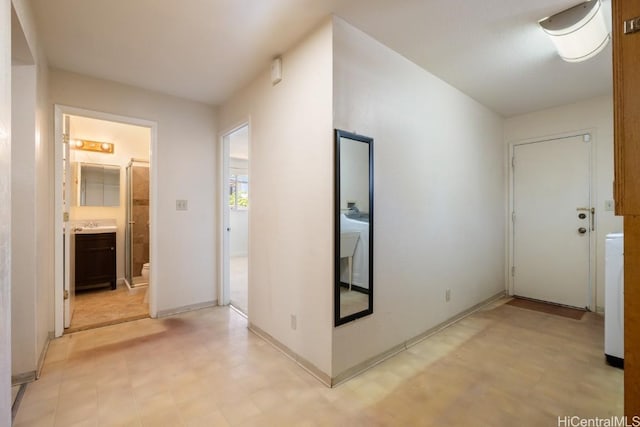 corridor with washer / clothes dryer