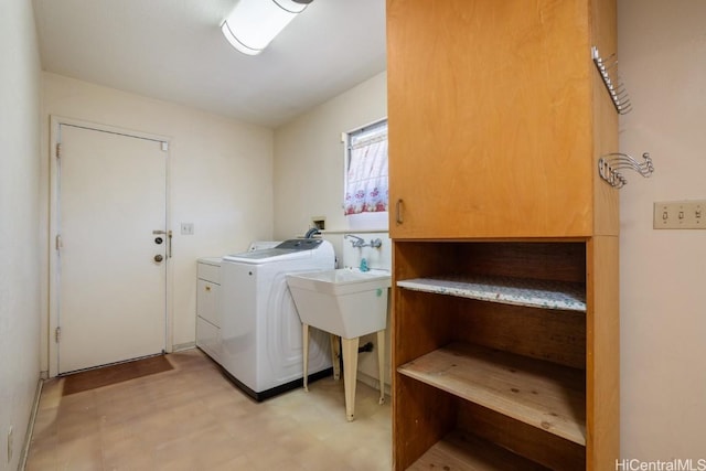 laundry room featuring cabinets and separate washer and dryer