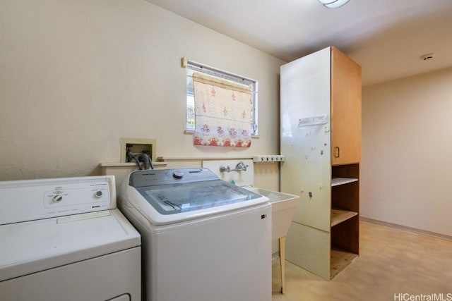 laundry room with cabinets and separate washer and dryer