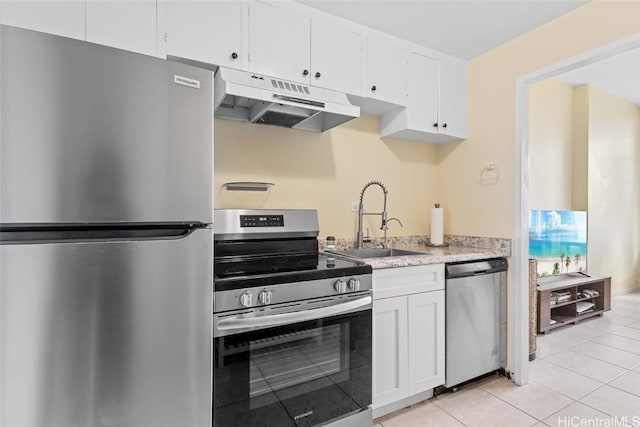 kitchen featuring sink, white cabinetry, stainless steel appliances, and light tile patterned flooring