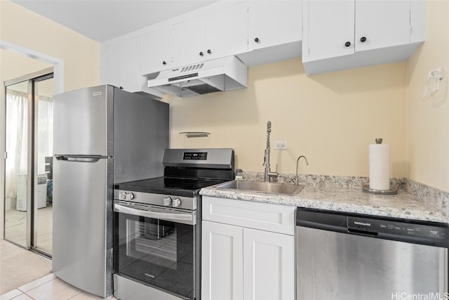 kitchen featuring sink, light tile patterned floors, white cabinets, and stainless steel appliances