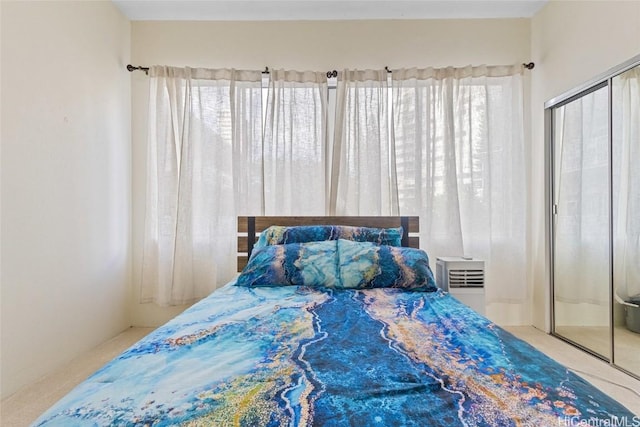 bedroom featuring a closet and multiple windows