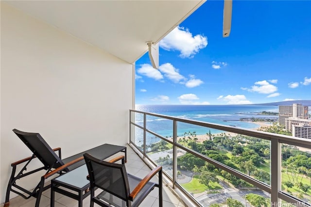 balcony with a view of the beach and a water view