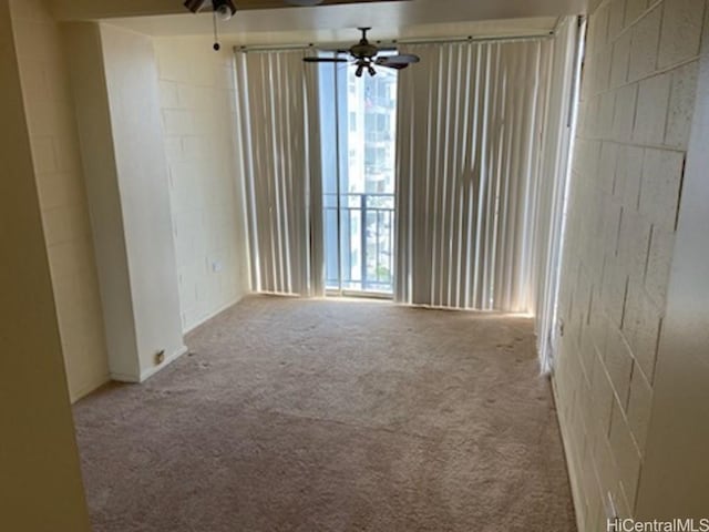 carpeted empty room with ceiling fan