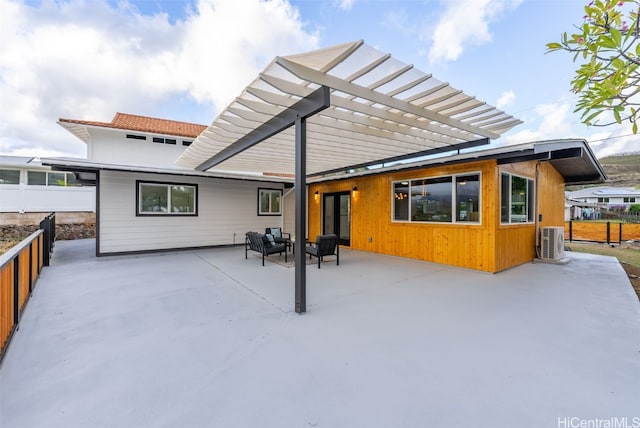 rear view of house with a pergola, an outdoor living space, ac unit, and a patio