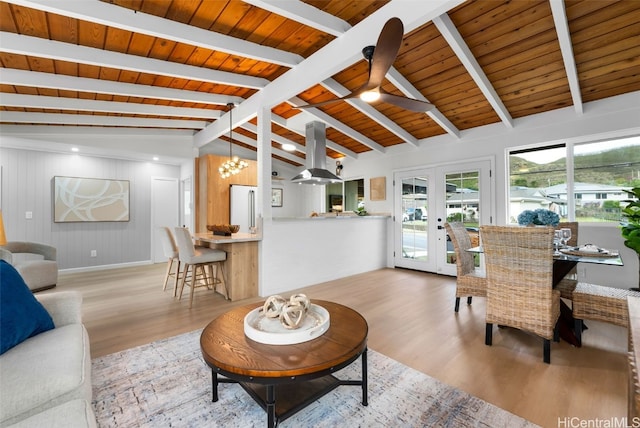 living room featuring french doors, lofted ceiling with beams, light hardwood / wood-style floors, and wood ceiling