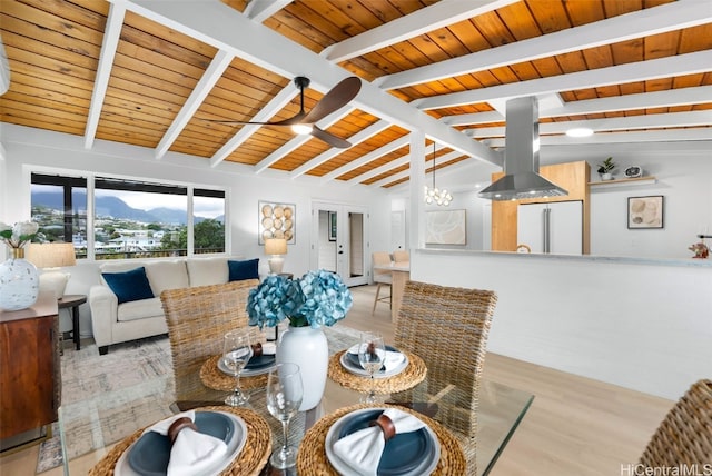 dining room with wooden ceiling, an inviting chandelier, french doors, lofted ceiling with beams, and light hardwood / wood-style flooring