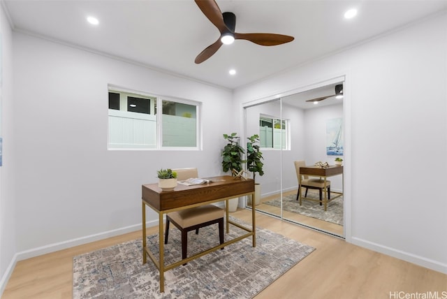 office with ceiling fan, light hardwood / wood-style floors, and ornamental molding