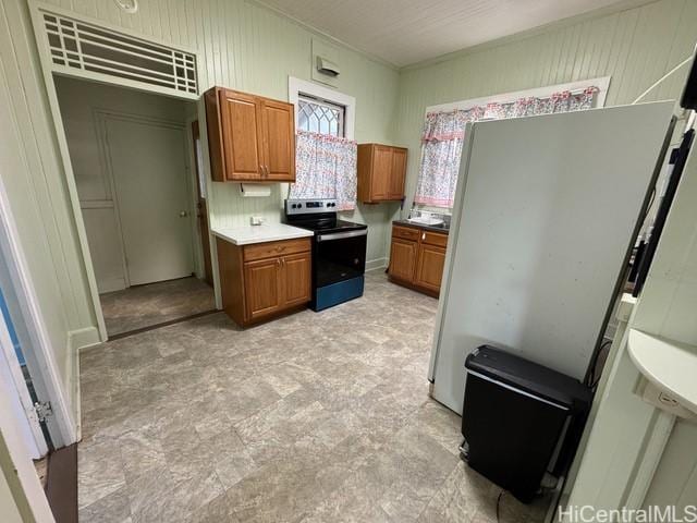 kitchen featuring decorative backsplash and stainless steel electric range