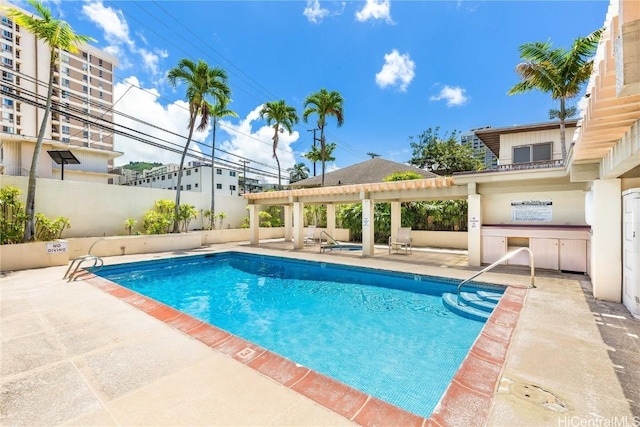 view of swimming pool featuring a patio area