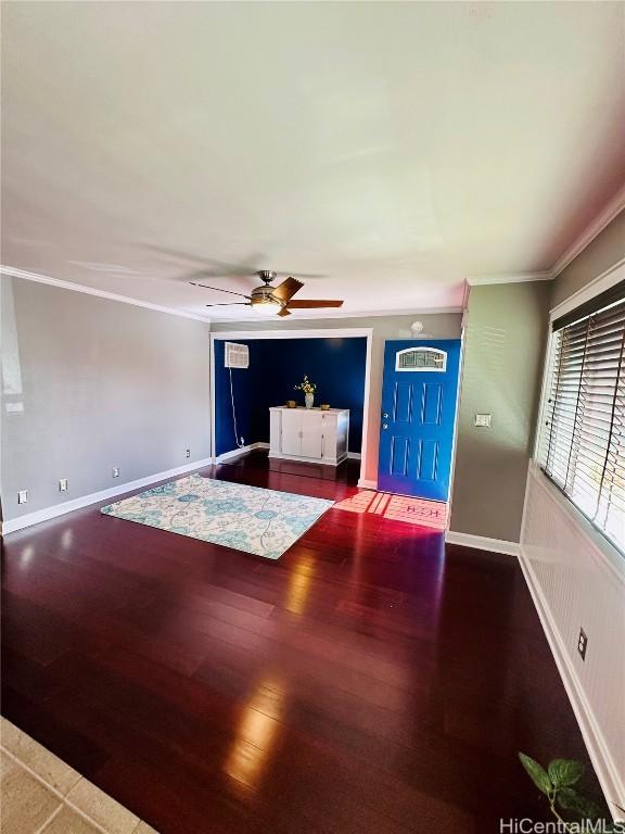 entrance foyer featuring crown molding, wood-type flooring, and ceiling fan