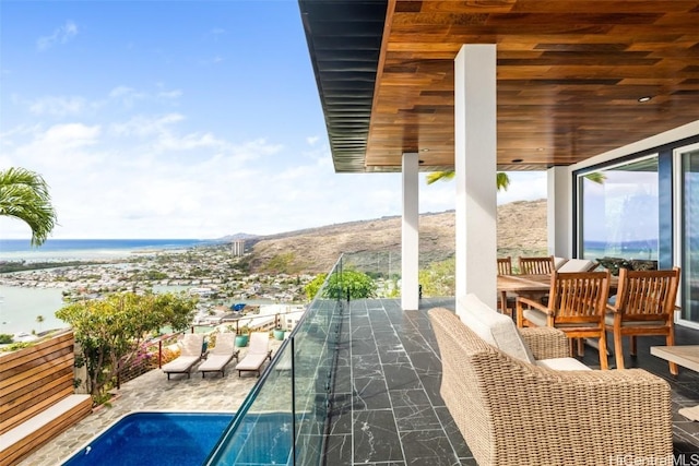 balcony featuring a water view