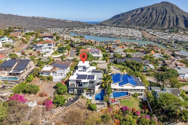 drone / aerial view featuring a water and mountain view