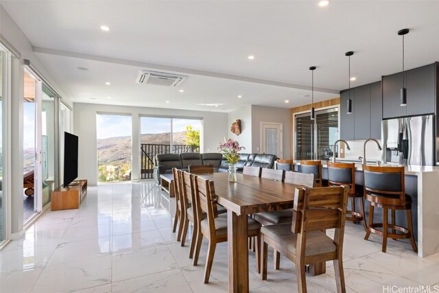 dining space featuring a wealth of natural light