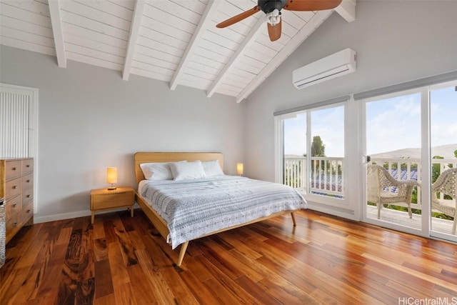 bedroom with a wall mounted air conditioner, ceiling fan, wood-type flooring, and access to outside