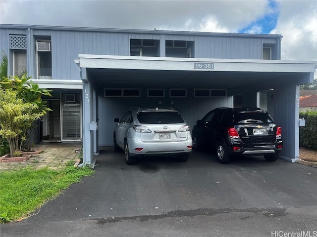 exterior space featuring a carport