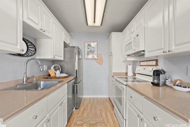 kitchen featuring white cabinetry, white appliances, sink, and light hardwood / wood-style flooring