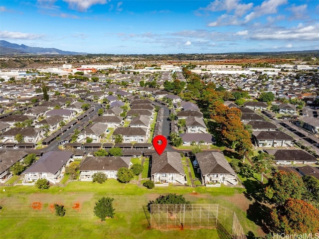 birds eye view of property with a mountain view