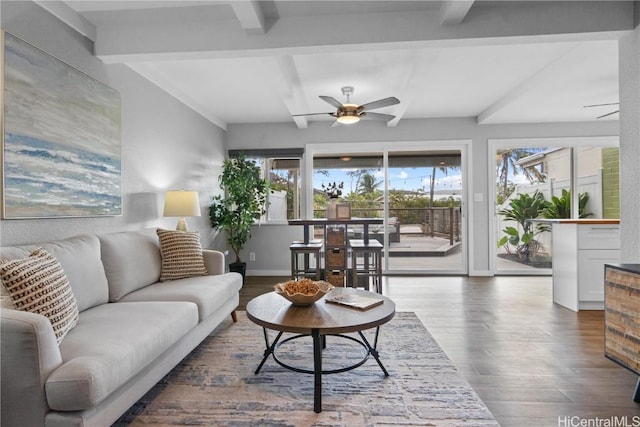 living room with beamed ceiling, ceiling fan, and wood-type flooring