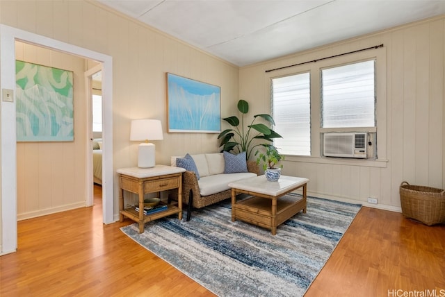 living room featuring cooling unit and wood-type flooring