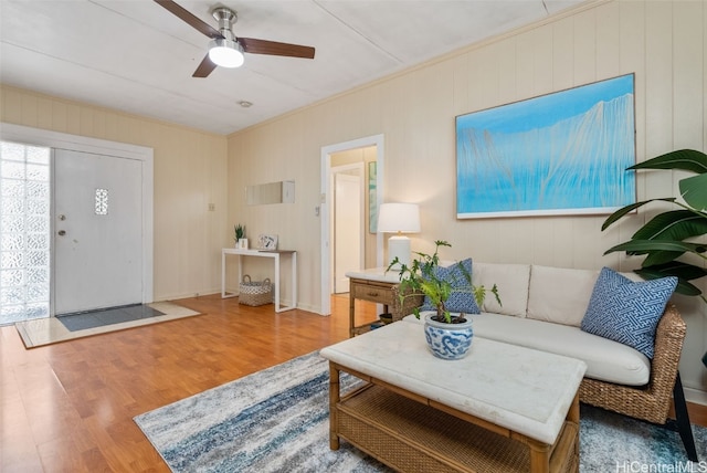 living room with hardwood / wood-style floors and ceiling fan