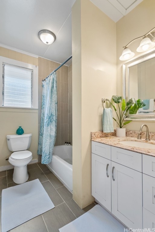 full bathroom featuring tile patterned floors, shower / bath combination with curtain, toilet, and vanity