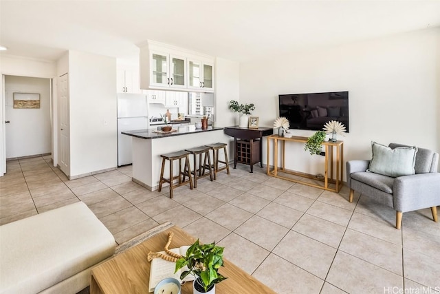 living room featuring light tile patterned floors