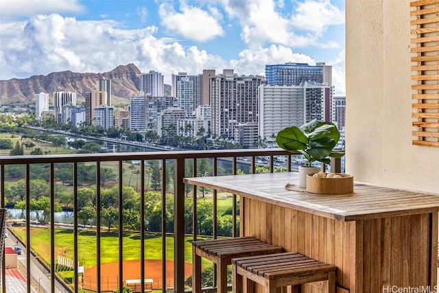 balcony featuring a mountain view