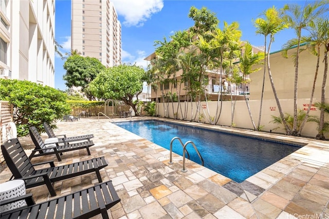 view of pool with a fenced backyard, a fenced in pool, and a patio