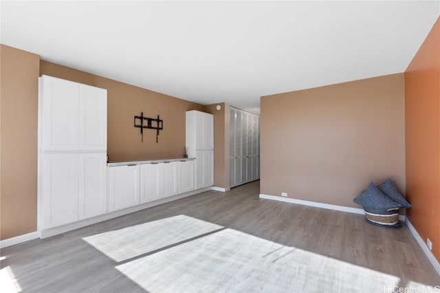 spare room featuring light hardwood / wood-style flooring