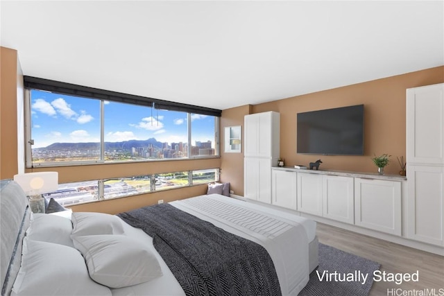 bedroom with light wood-type flooring