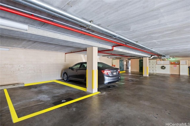 parking deck featuring concrete block wall