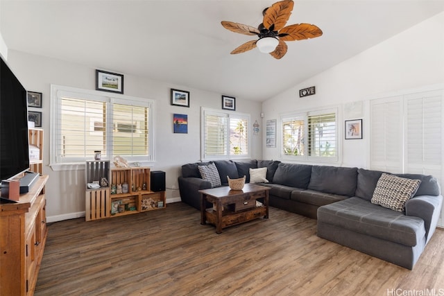 living room with lofted ceiling, ceiling fan, and dark hardwood / wood-style floors