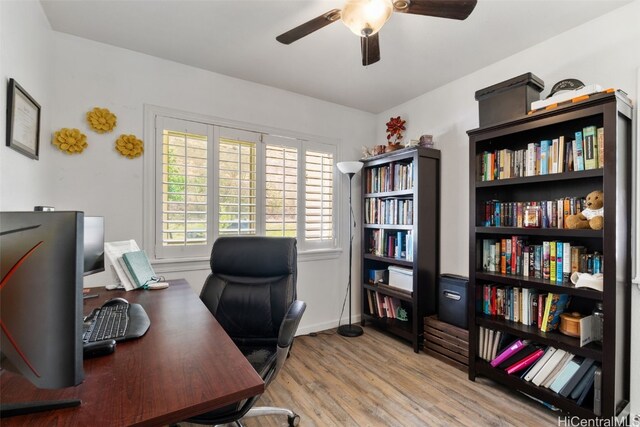 office space featuring light wood-type flooring and ceiling fan