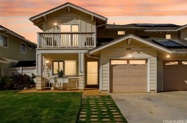 exterior space with a lawn and a balcony