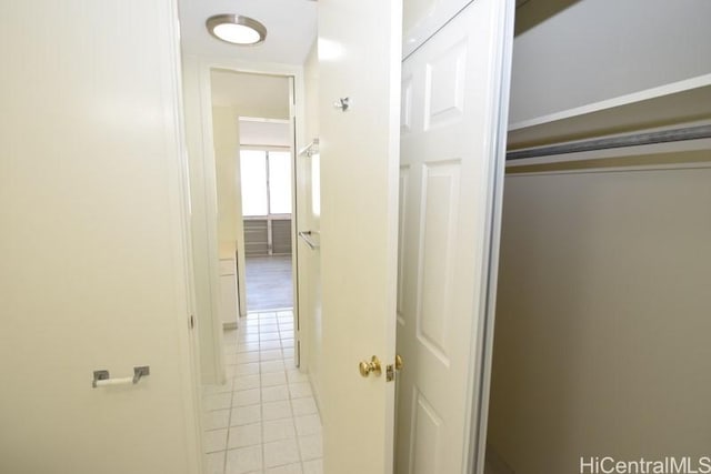 corridor featuring light tile patterned flooring