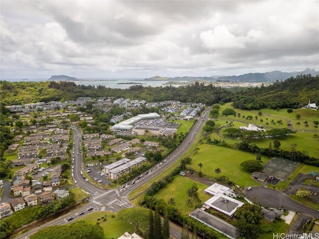 birds eye view of property with a water and mountain view