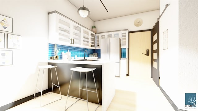 kitchen with white cabinets, white refrigerator, and sink