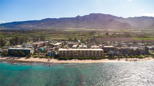 property view of mountains featuring a water view and a beach view